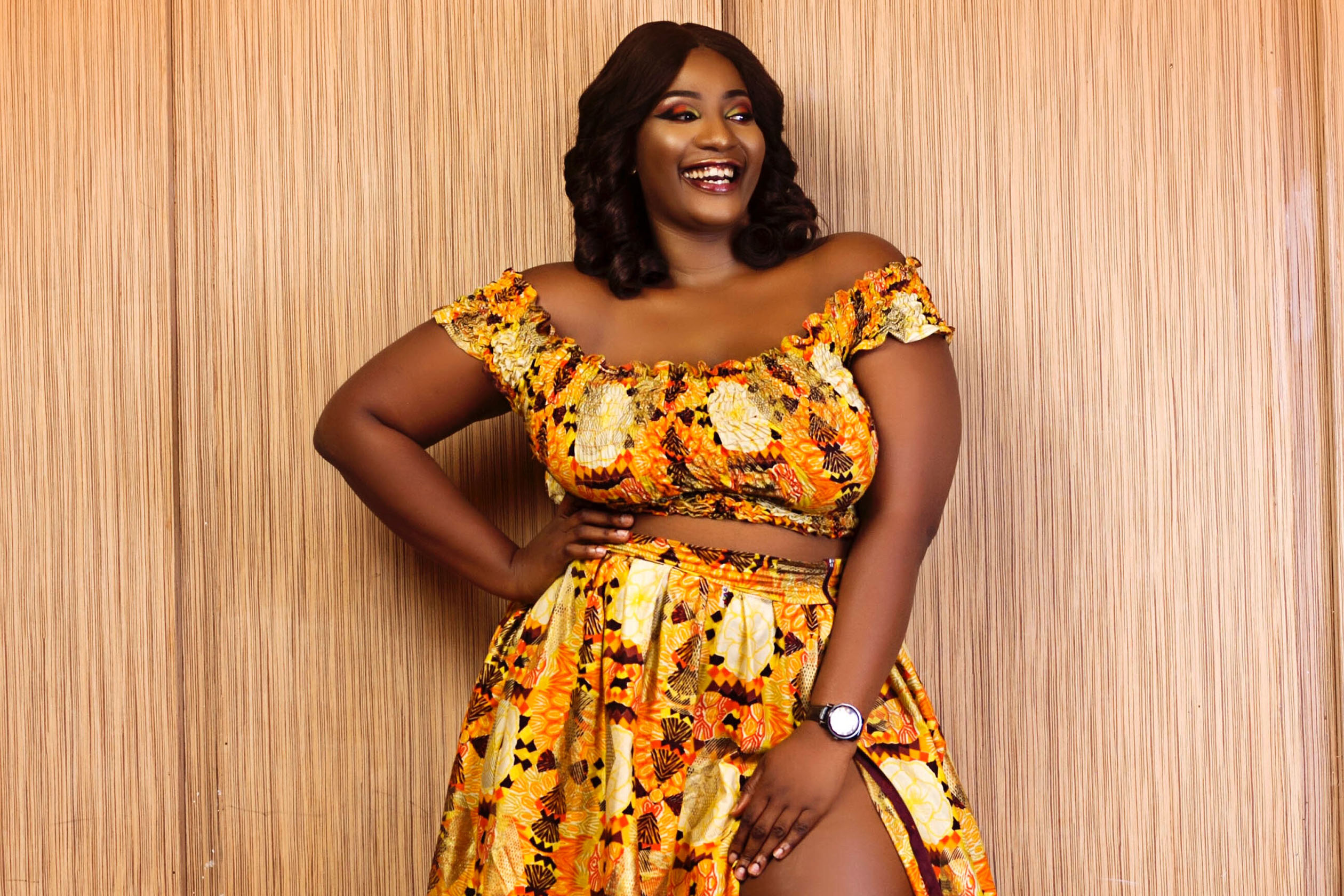 PLus-size woman wearing a bold patterned dress set