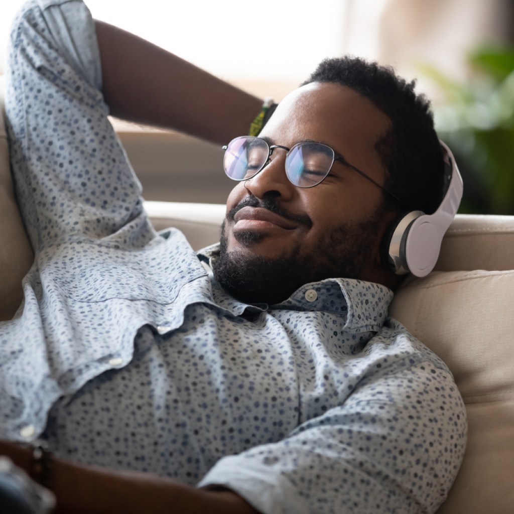 A man listening to a fun podcast.