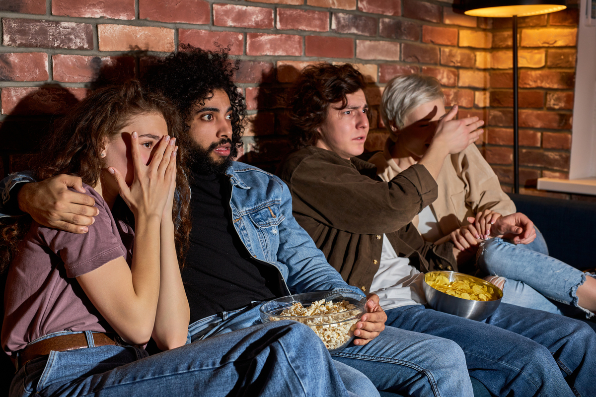 A group of friends watching a scary movie.