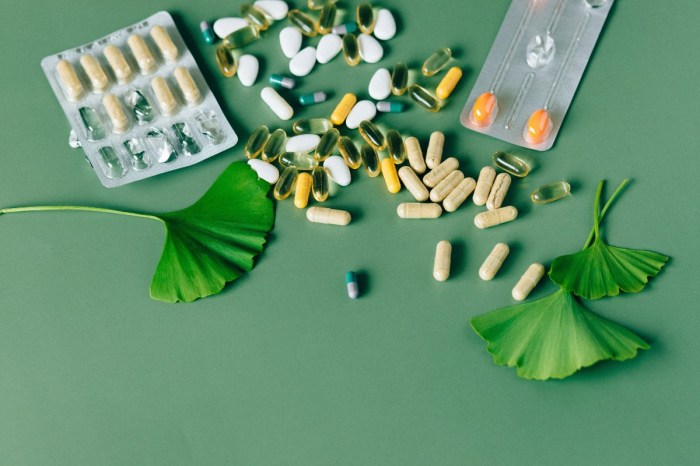 a flatlay of supplements on a green background