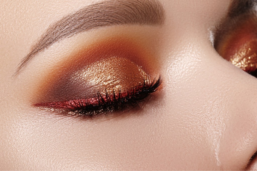 Closeup of woman's eyes with metallic eyeshadow