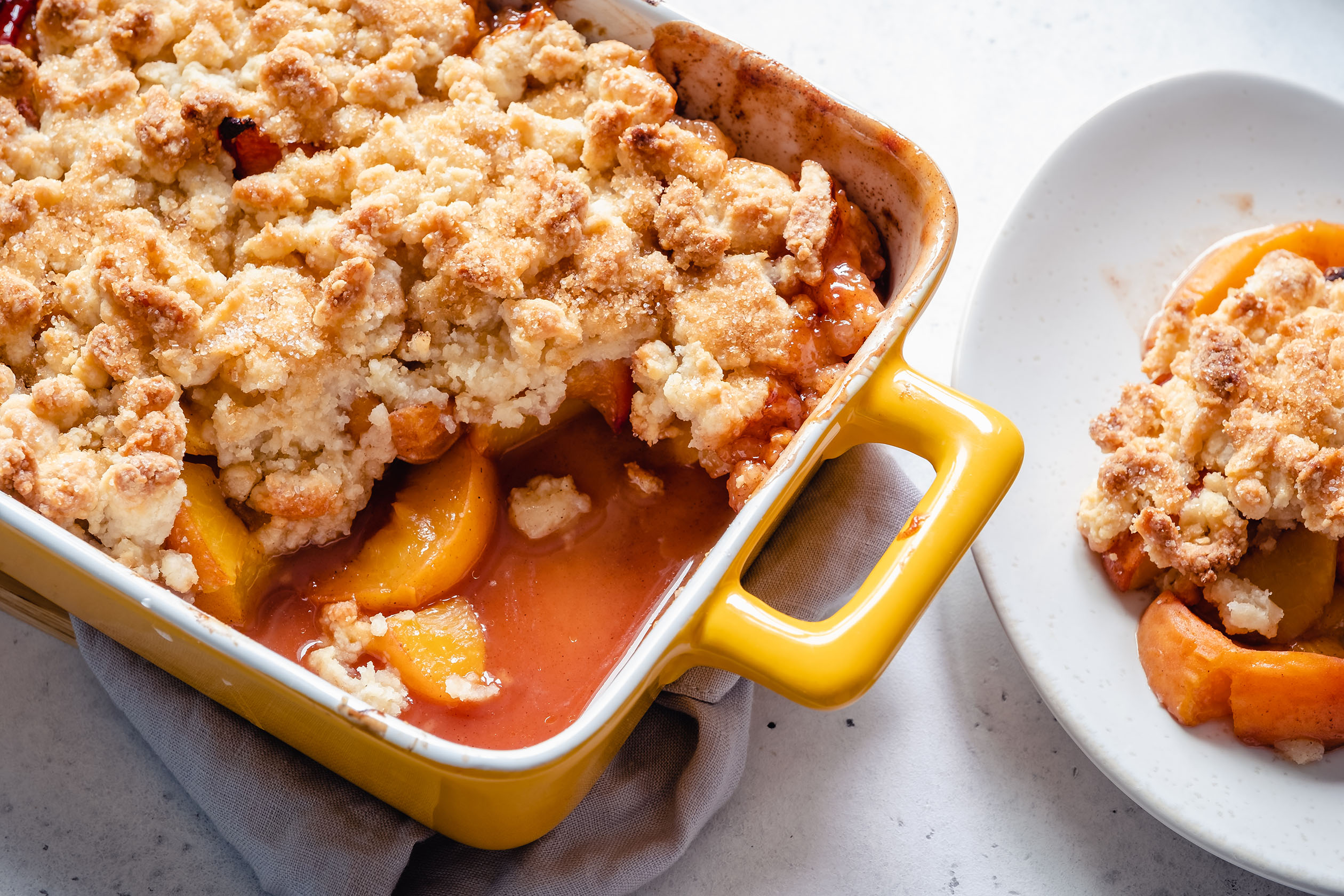 Peach cobbler in a baking dish