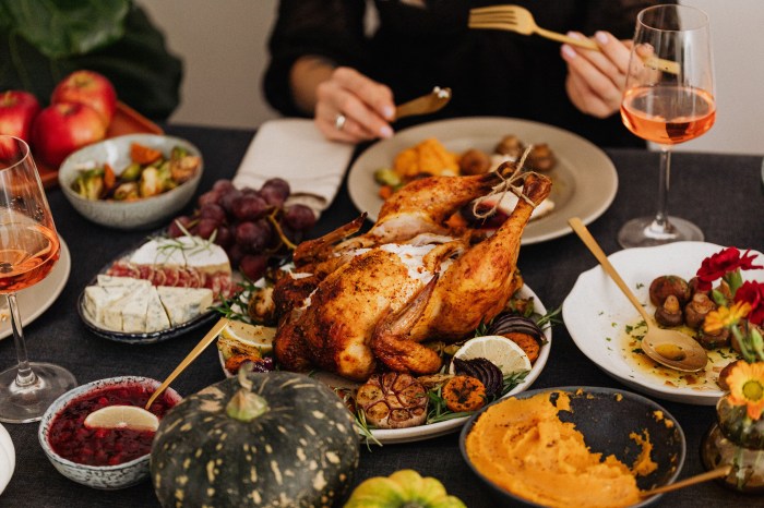 People enjoying turkey at Thanksgiving dinner