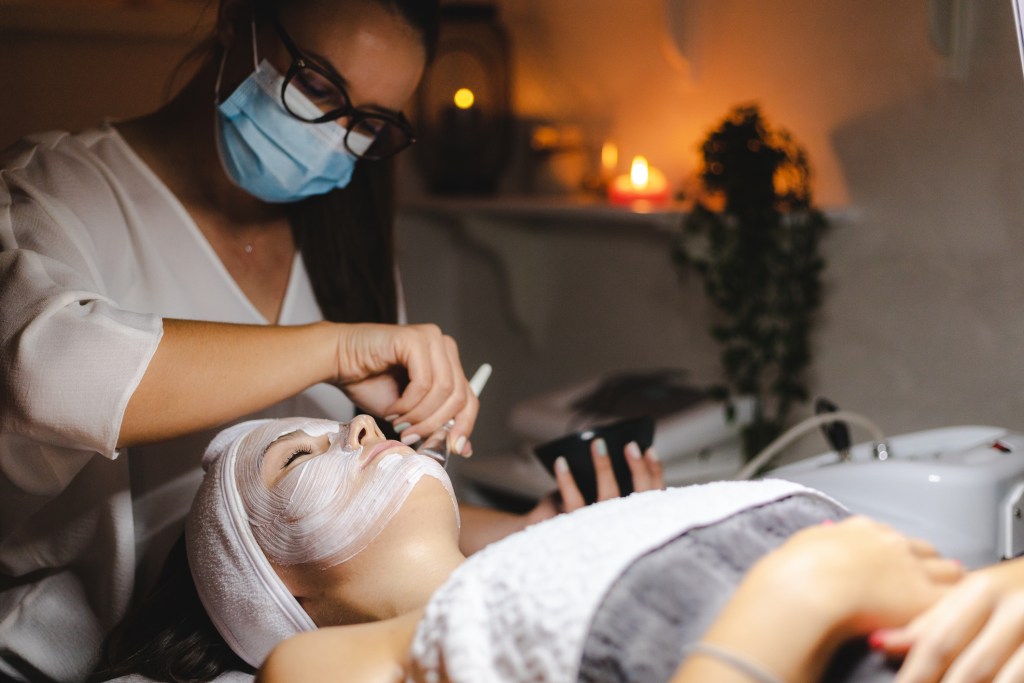 Woman receiving touchless facial