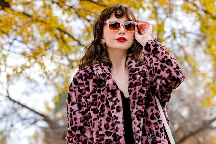 Woman wearing a faux fur pink leopard print coat
