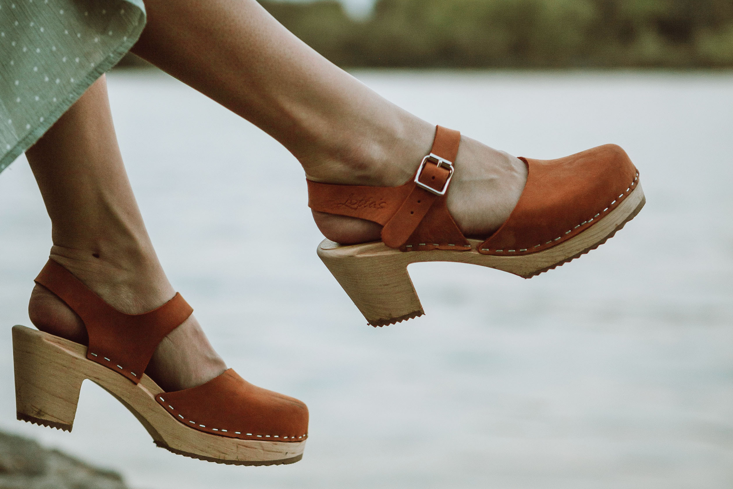 Woman wearing heeled clogs