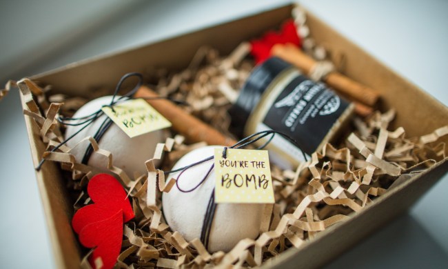 A gift basket with bath bombs and a candle