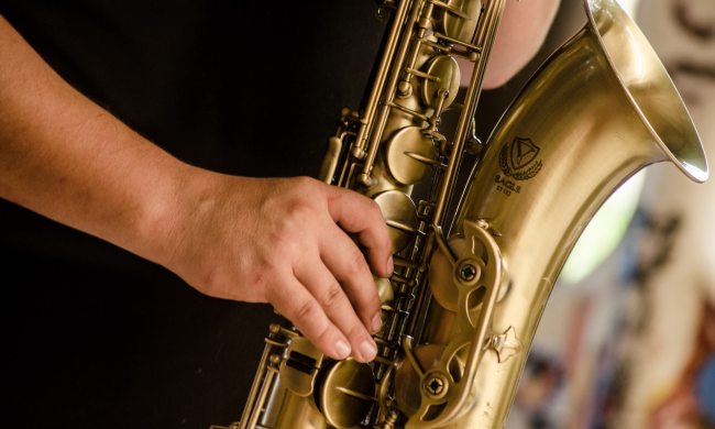 products for aspiring saxophonist man playing saxophone