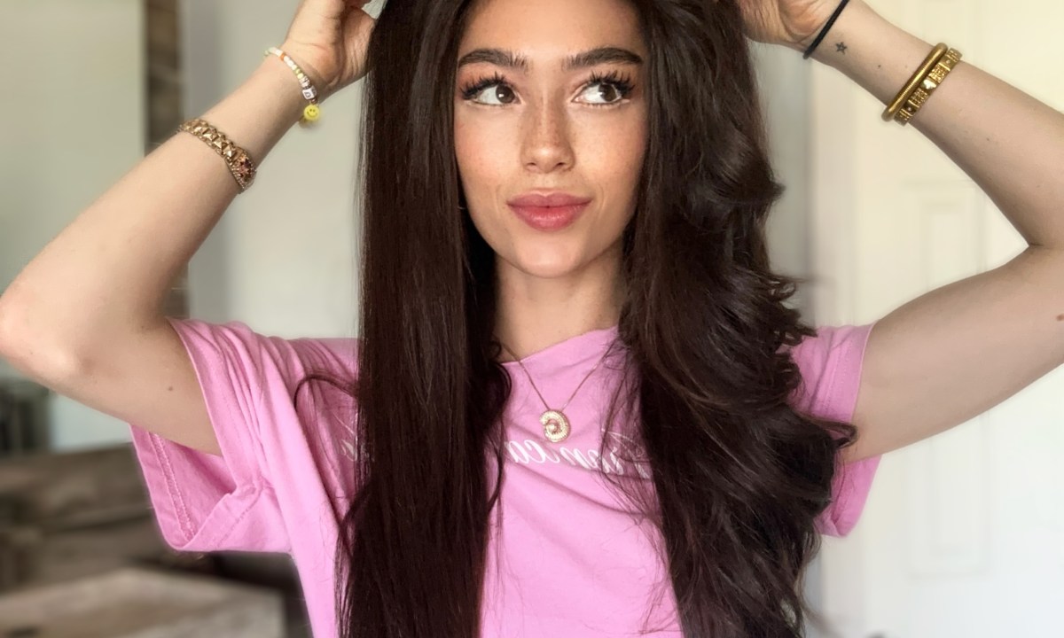 woman touching her hair